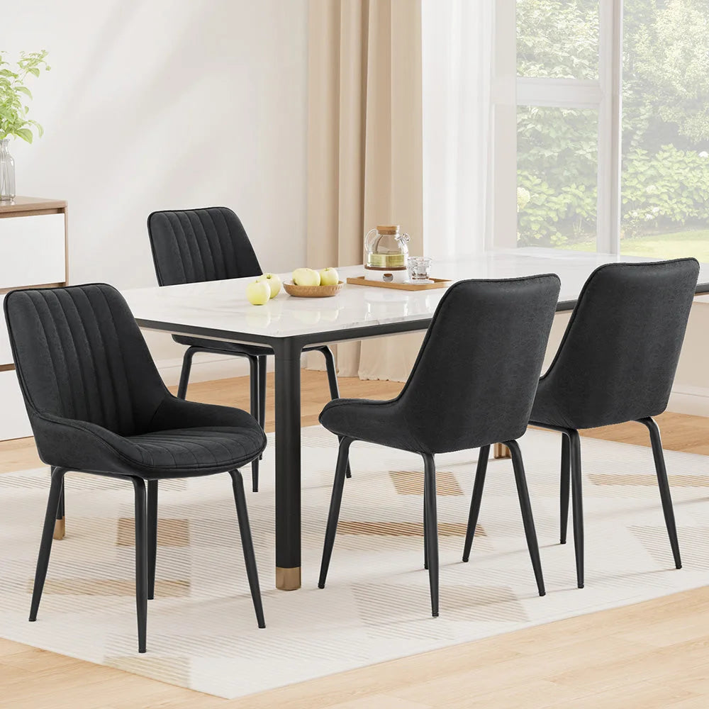 Set of four black PU leather dining chairs
