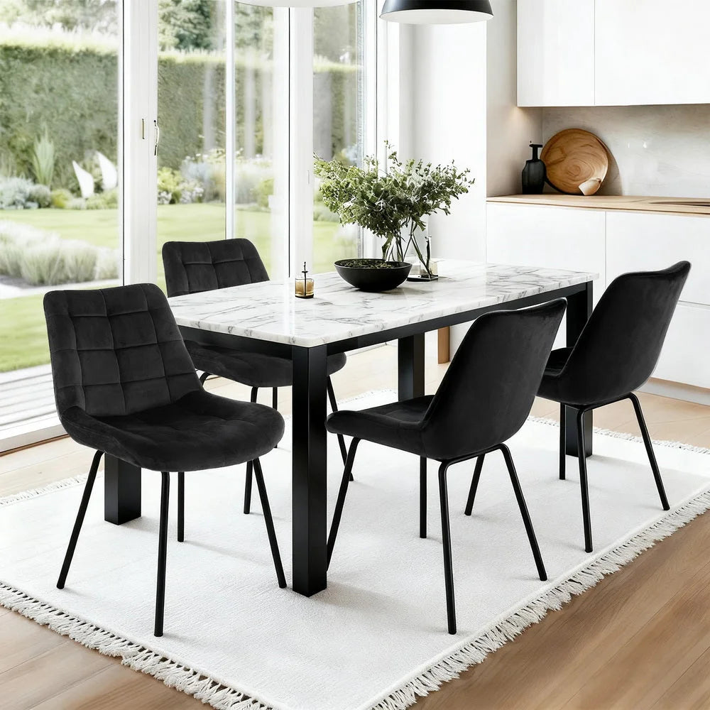 Set of four black velvet dining chairs