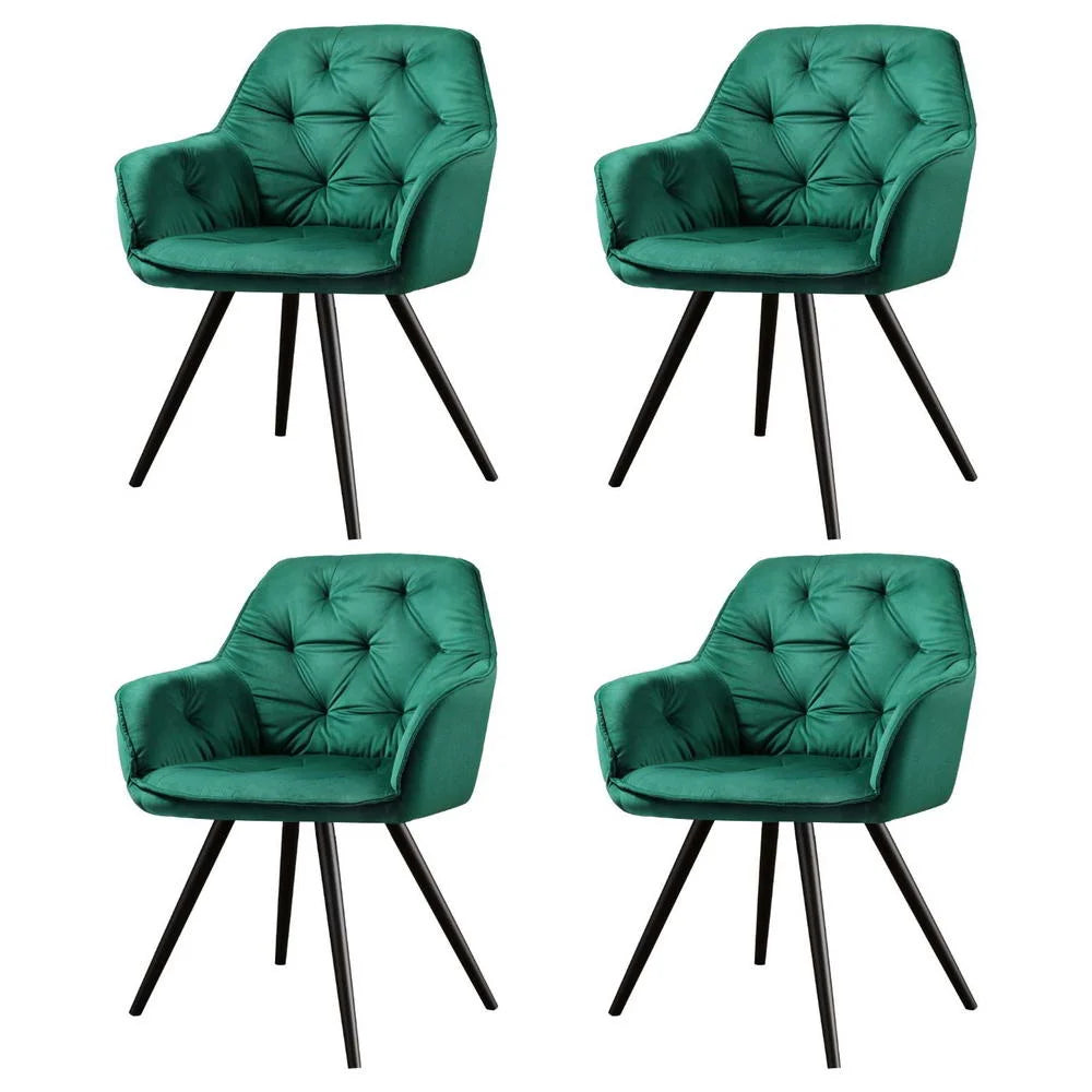 Set of four green velvet dining chairs