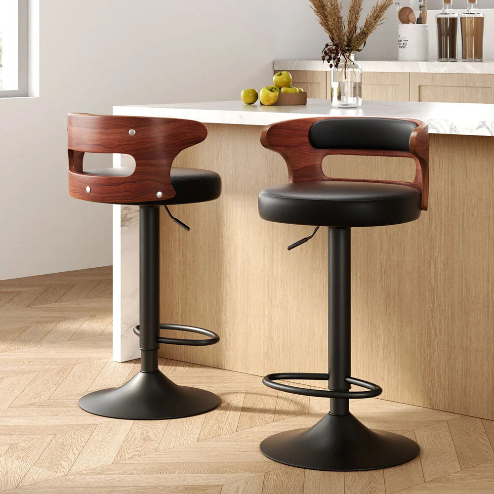Black wooden bar stool set with shaped seat and supportive backrest