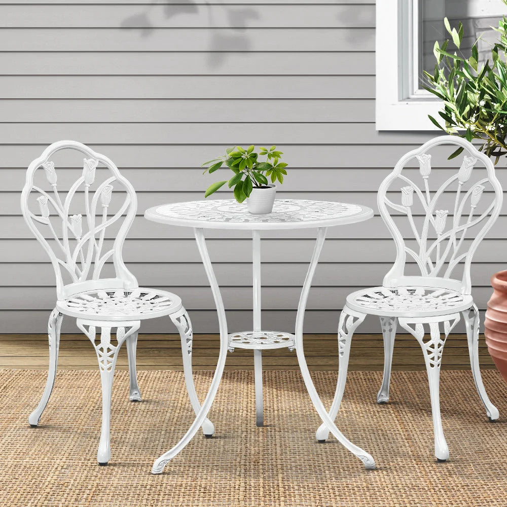 White aluminium outdoor patio set with wicker chairs and matching side table
