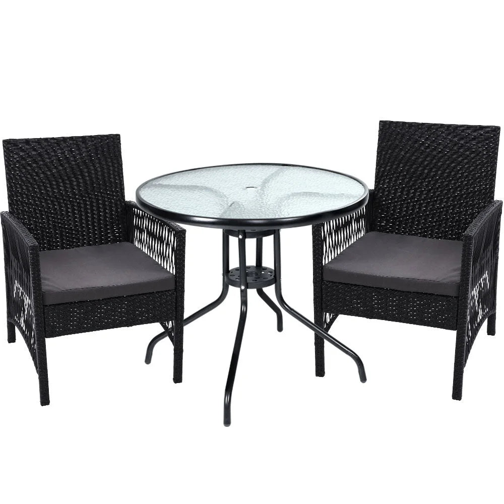 Black wicker outdoor patio set with white wicker seats and grey cushions