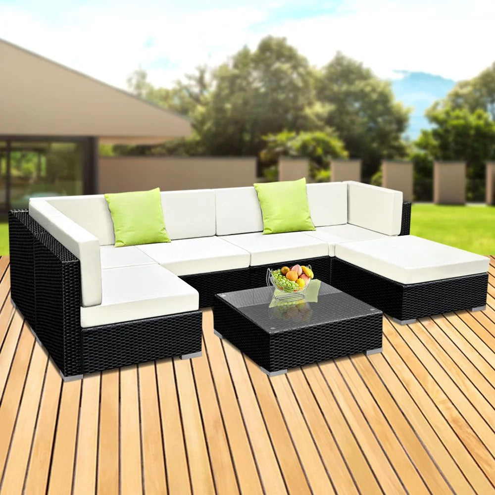 Wicker outdoor sofa patio with seat cushions and low coffee table