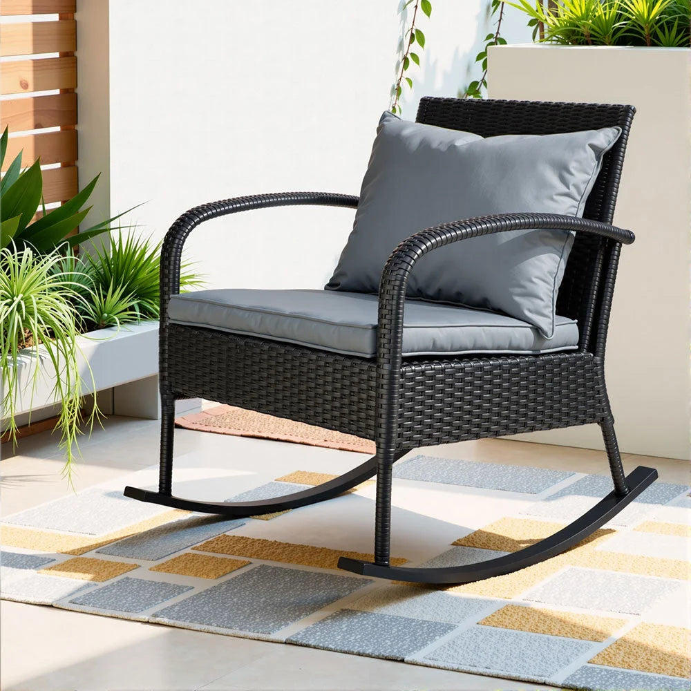 Black wicker outdoor rocking chair with mesh backrest and caster base