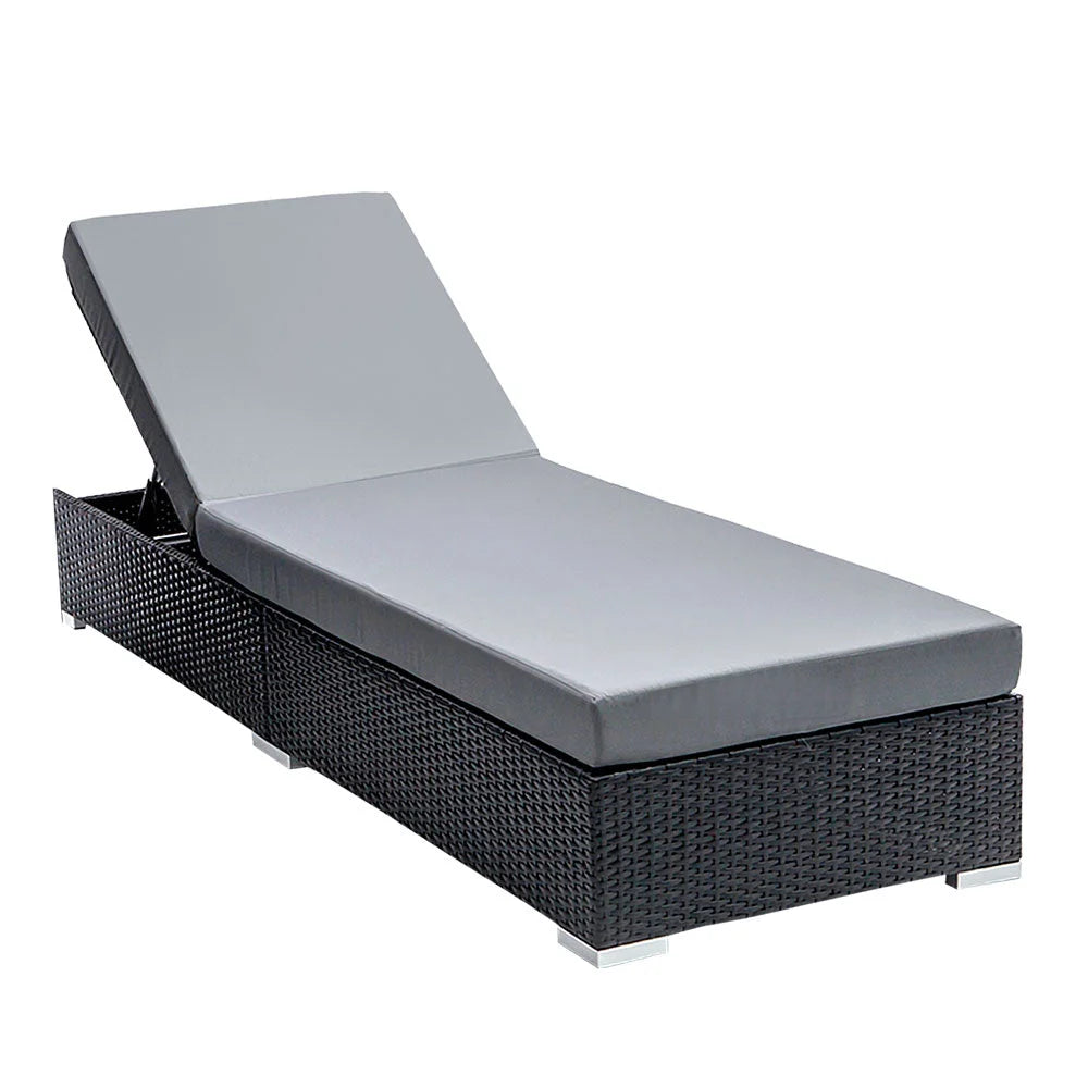 Black wicker outdoor sun lounge with shape details and included parts