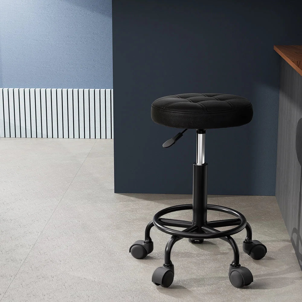 Black salon stool swivel with attachment points and product body