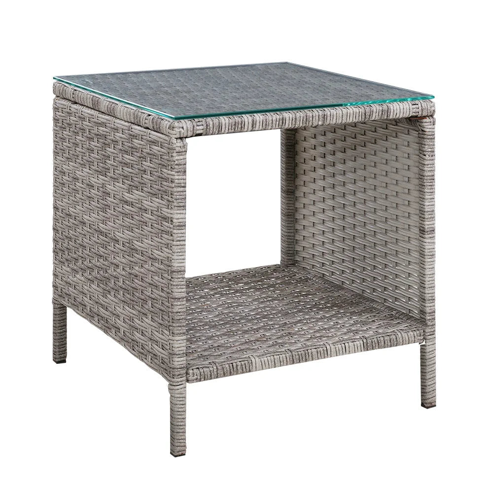 Grey rattan coffee table with glass top and living room shelf