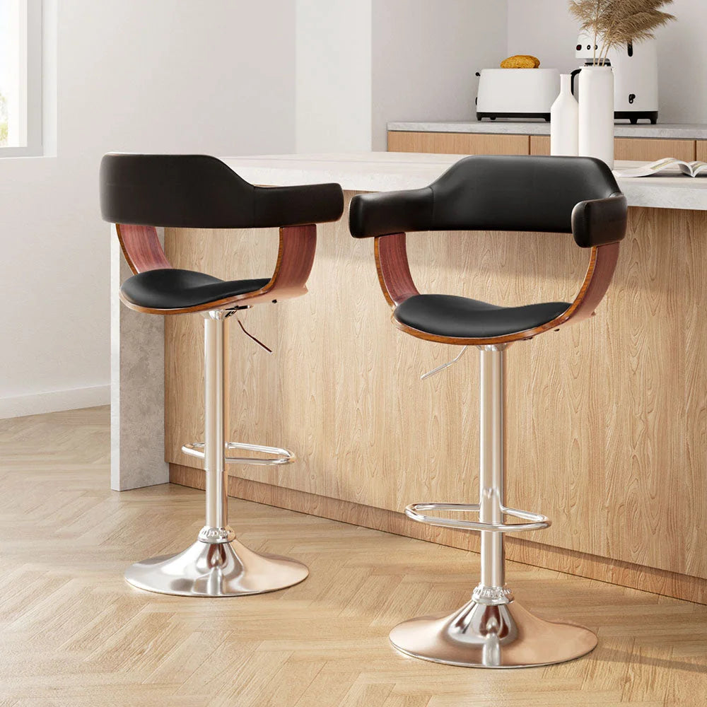 Set of two black leather swivel bar stools
