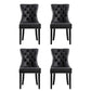 Black leather dining chair set with shaped seat and supportive backrest