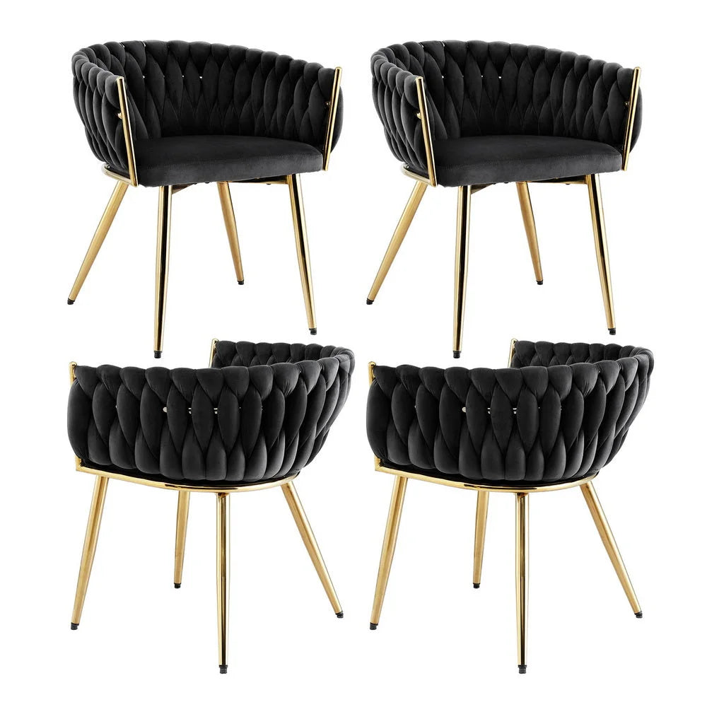 Set of four black velvet dining chairs