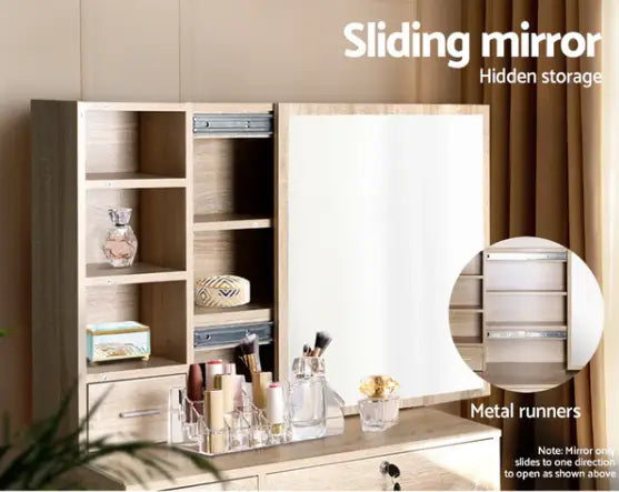 Dressing table with a sliding mirror revealing shelves behind it.