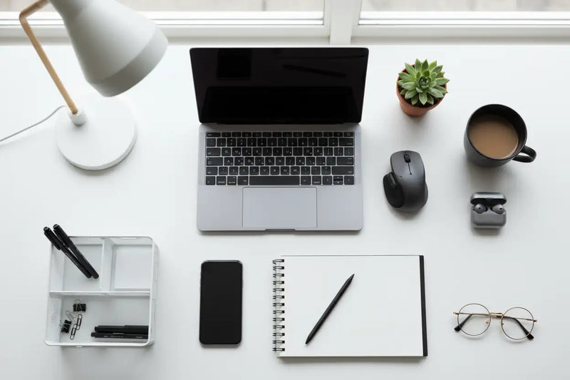 Create a image for keyword home and office essentials which includes some office products for laptop etc.