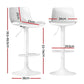 Set of four white leather dining chairs