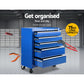 Blue tool box cabinet with red storage drawers and black wheels