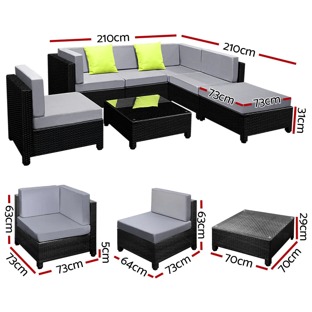 Black wicker outdoor sofa couches with seat cushions and low coffee table