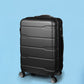 Black Slimbridge suitcase with its handle retracted against a blue background