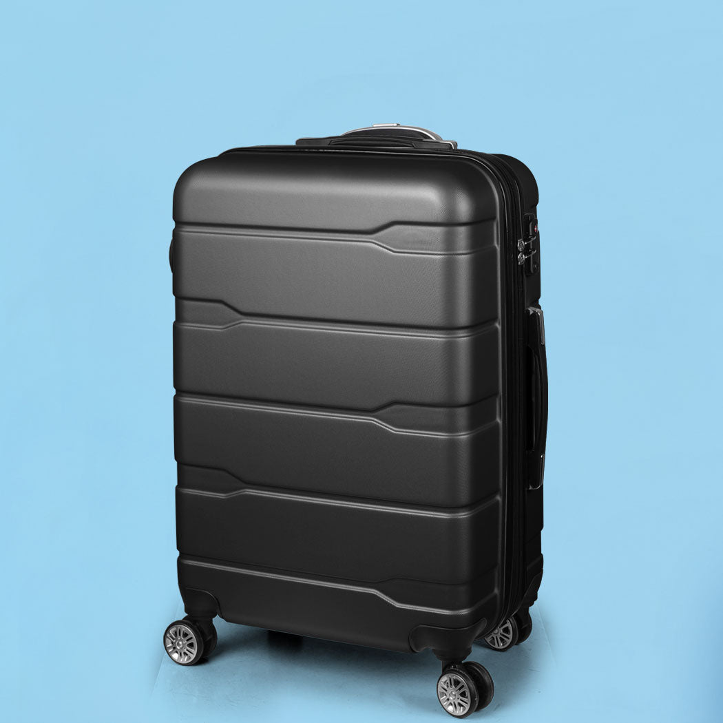 Black Slimbridge suitcase with its handle retracted against a blue background