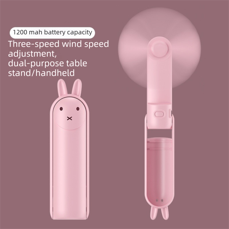 Pink Foldable Mini Handheld Fan—a portable, USB-rechargeable desktop fan featuring a cute rabbit design. It offers three speed settings, soft blades, and 270-degree rotation, with a built-in 1200mAh battery—ideal for travel, office use, and staying cool o