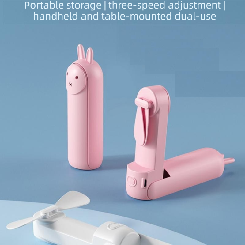 Pink Foldable Mini Handheld Fan—a portable, USB-rechargeable desktop fan featuring a cute rabbit design. It offers three speed settings, soft blades, and 270-degree rotation, with a built-in 1200mAh battery—ideal for travel, office use, and staying cool o