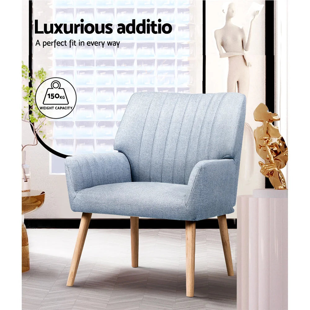 Grey fabric accent chair with armrests and tapered chair legs