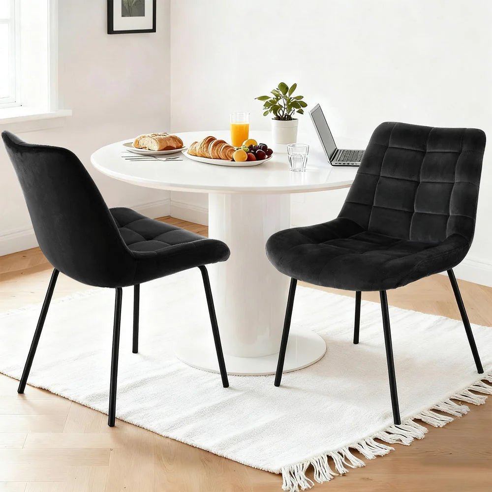 Set of two black velvet dining chairs