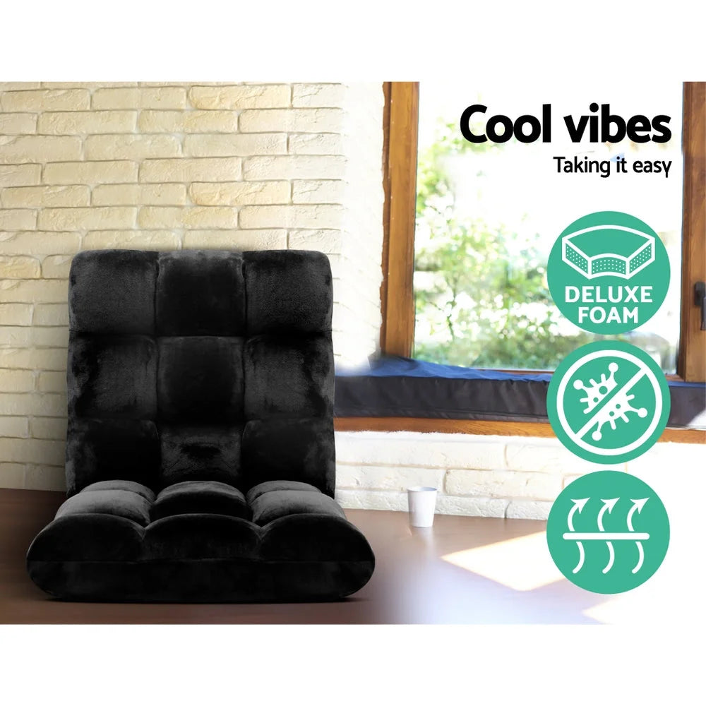 Black fabric lounge sofa bed with pack contents and accessory layout