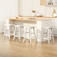 White wooden table with lower base and fitted supports