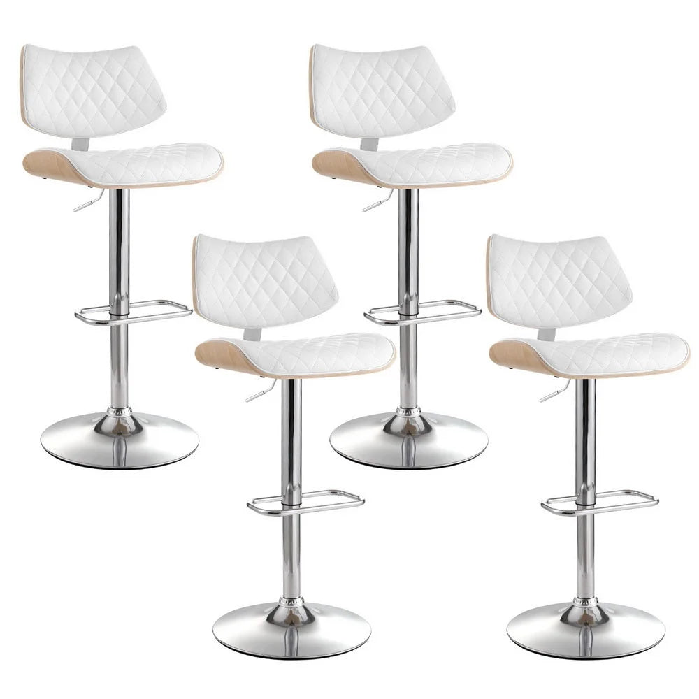 Set of four white leather dining chairs