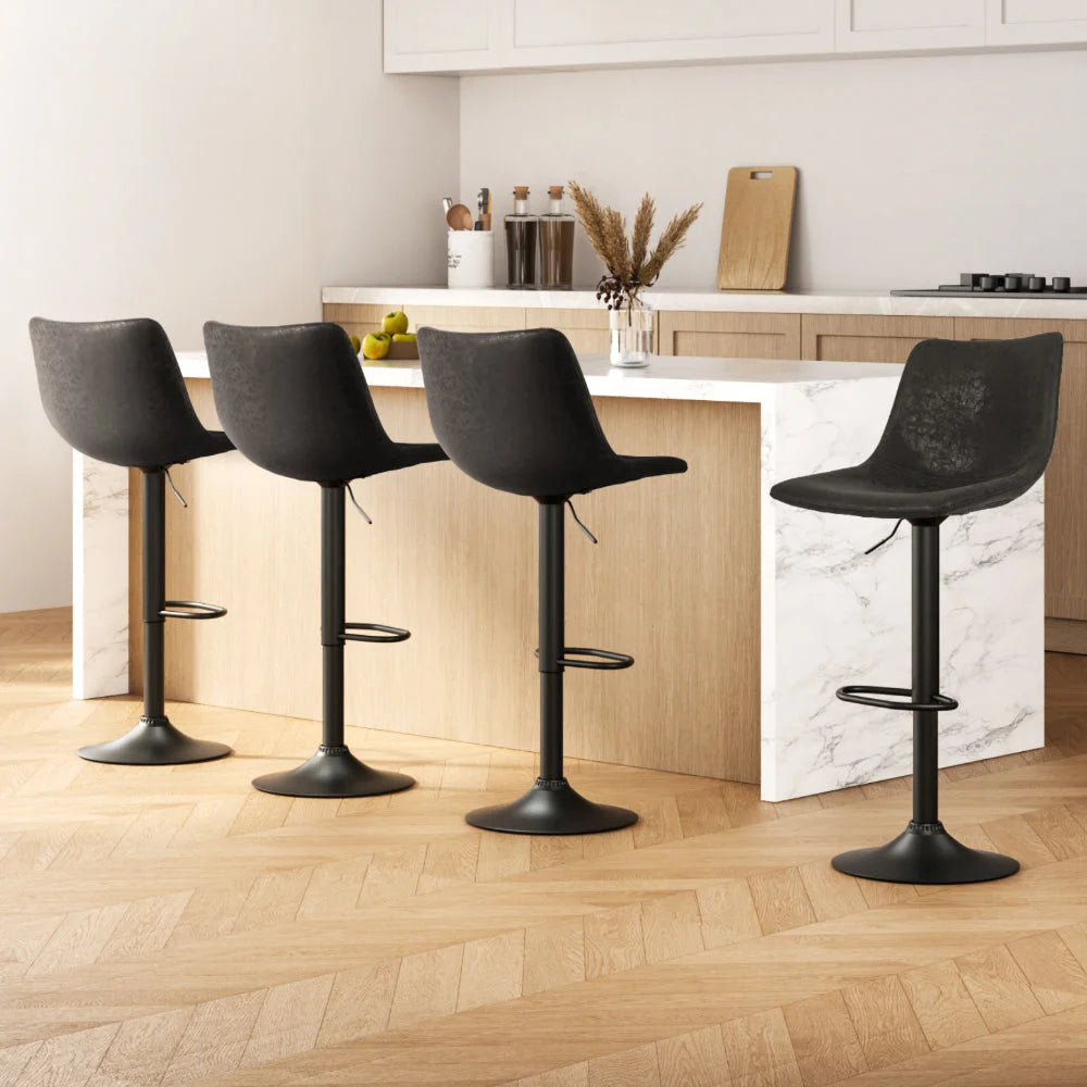 Set of four black leather gas lift swivel bar stools
