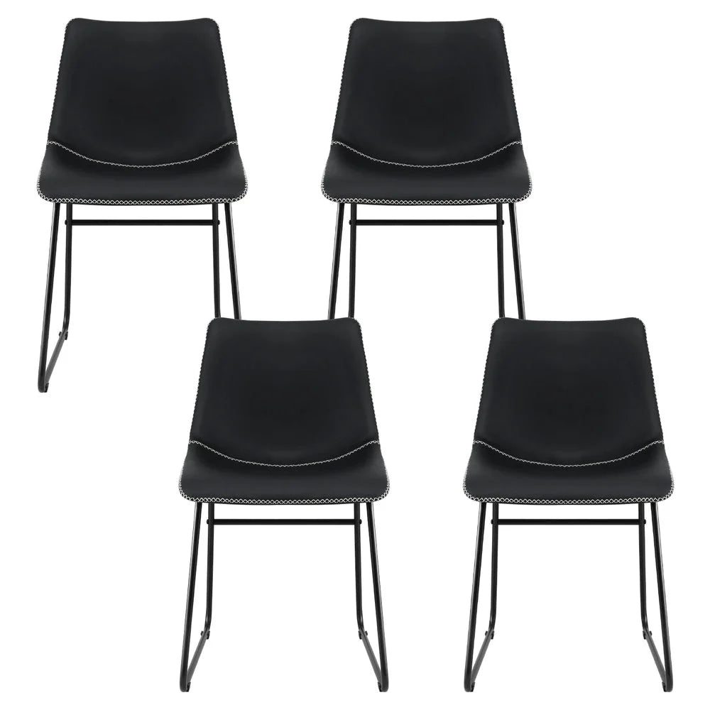 Set of four black PU leather dining chairs