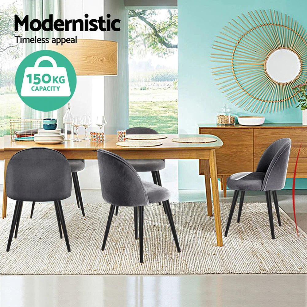Set of four grey velvet dining chairs