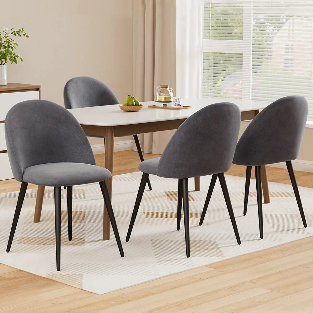 Set of four grey velvet dining chairs
