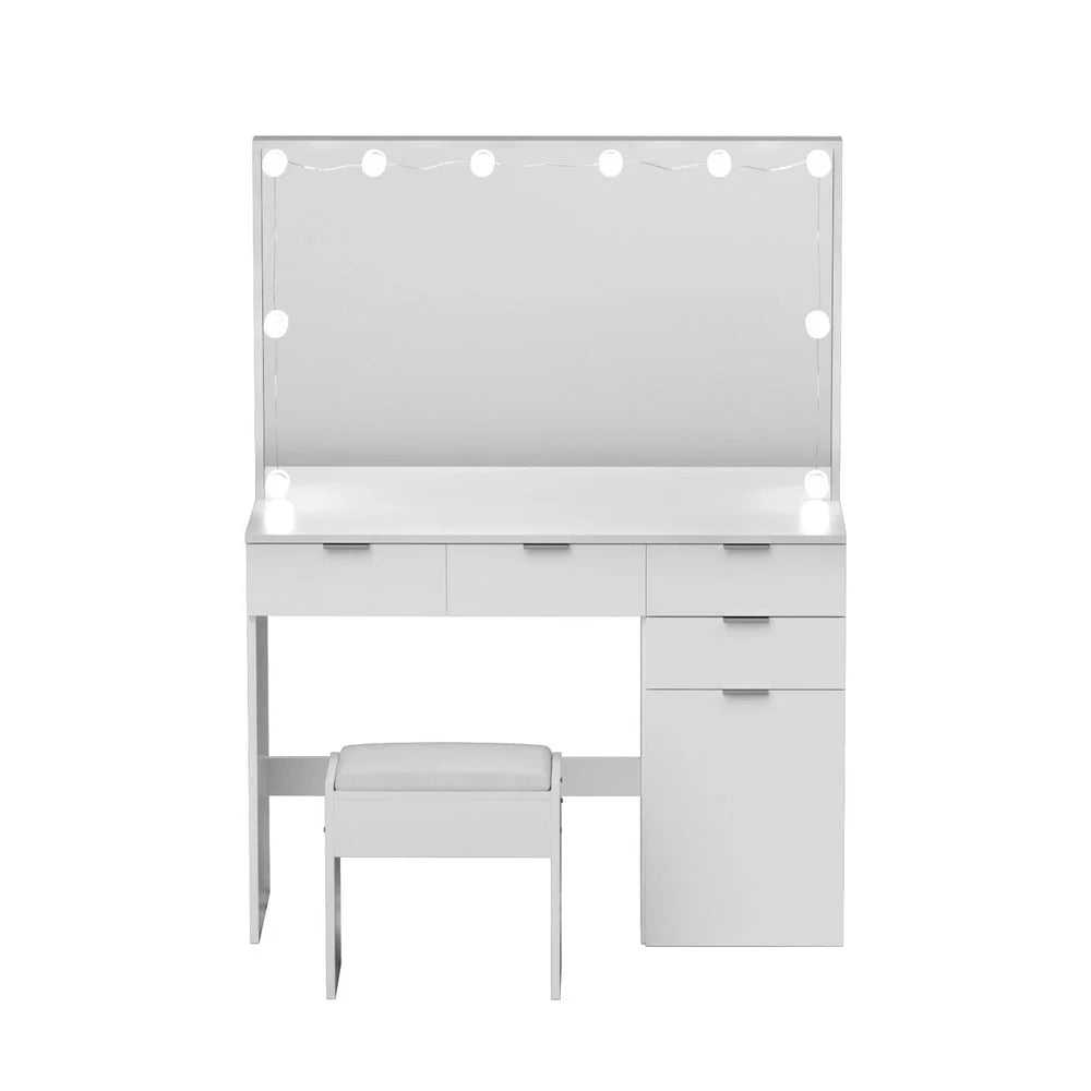 White dressing table stool with pack contents and accessory layout