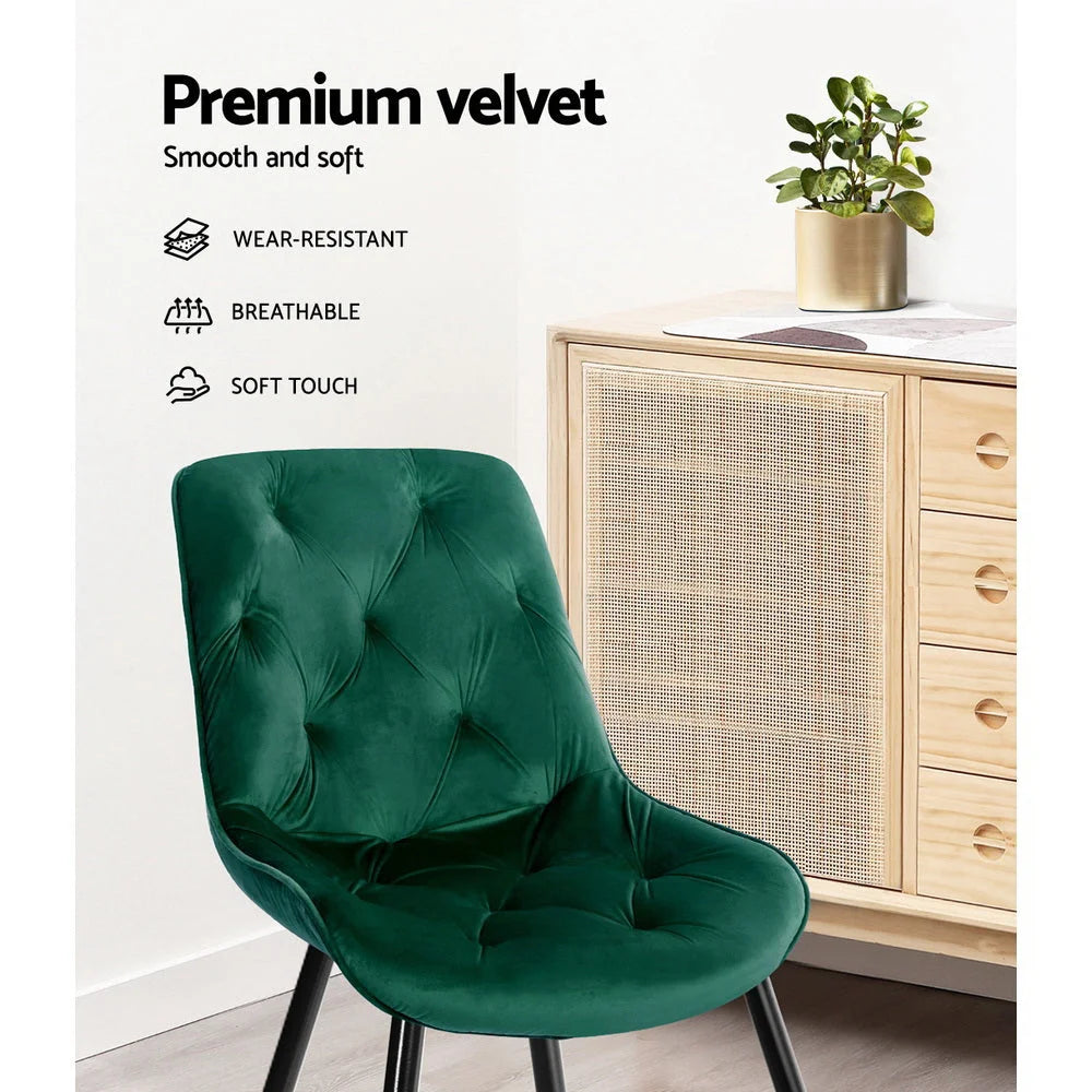 Green velvet dining chair set with cushioned seat and curved backrest