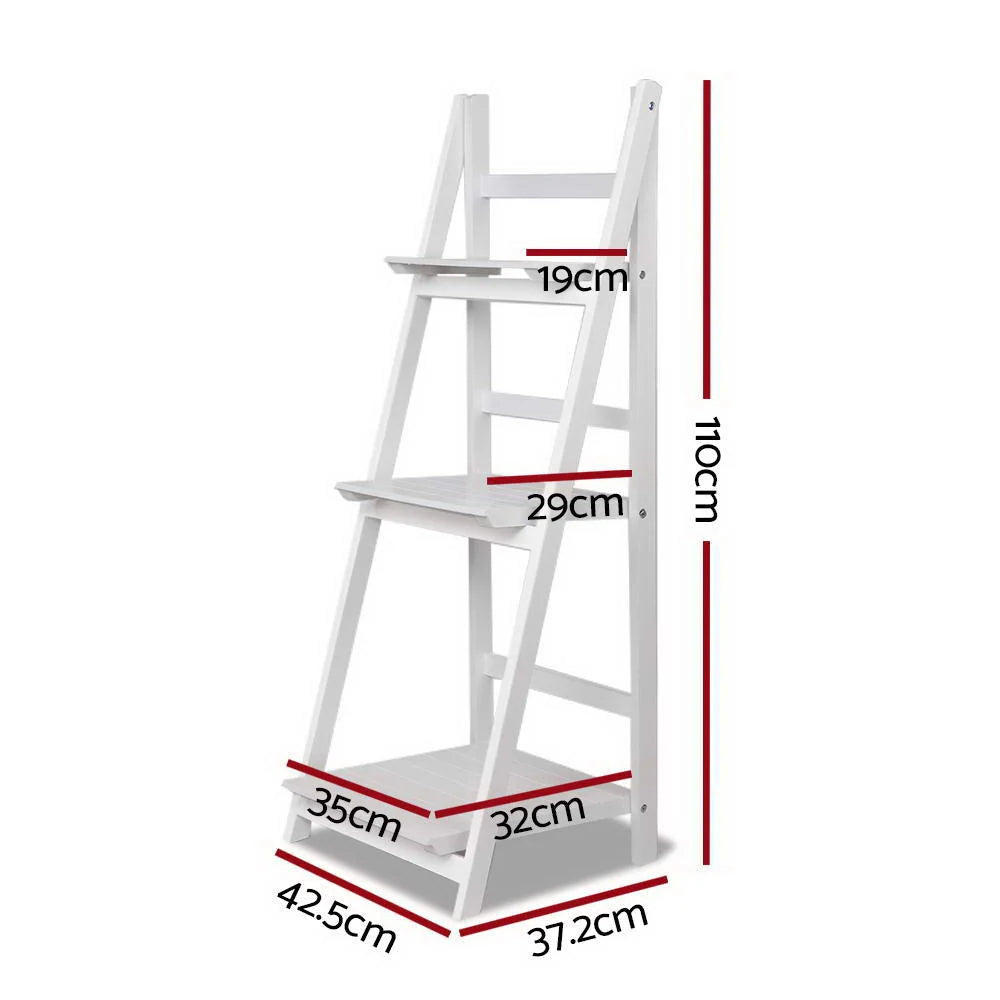 White wooden storage rack with tiered shelves and metal supports