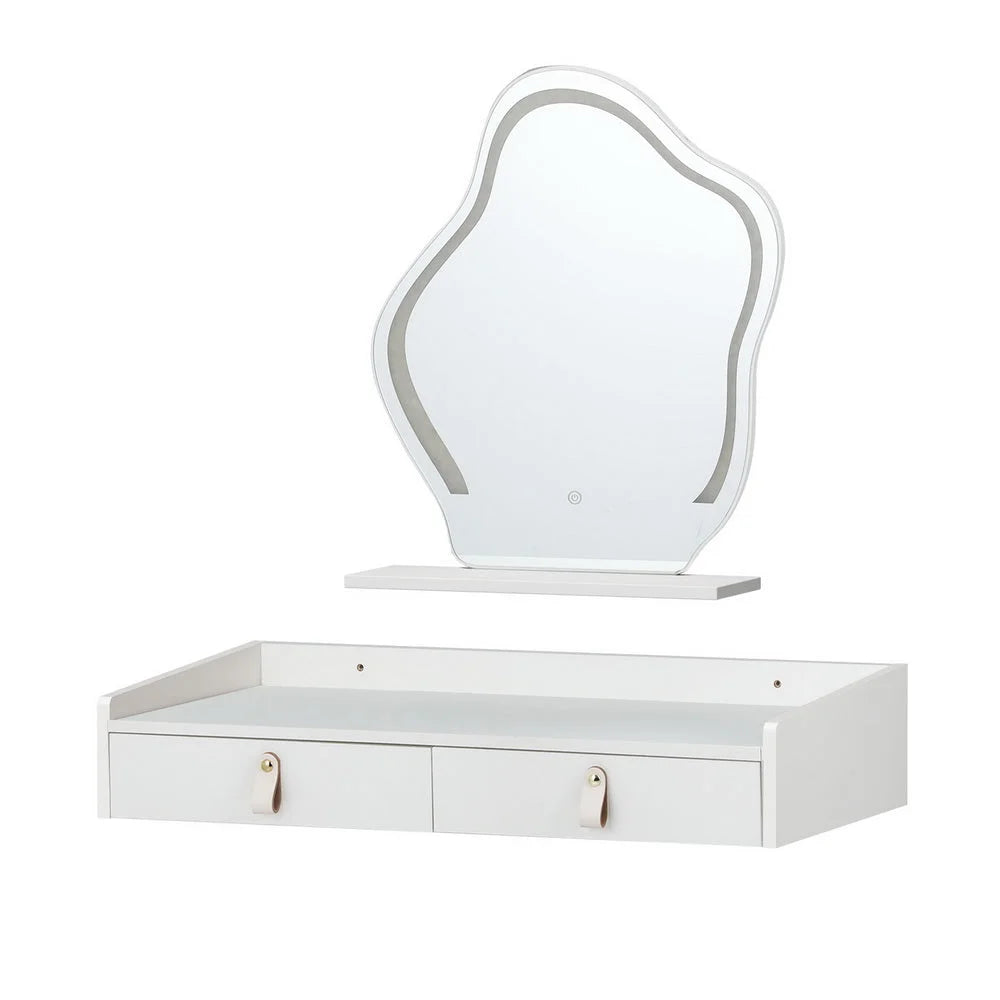 White dressing table floating with boxed accessories and matching pieces