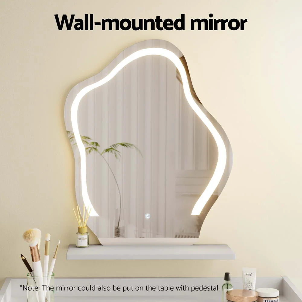 White dressing table floating with matching accessories and clear item layout