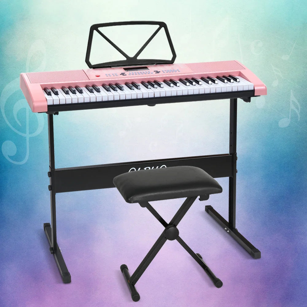 Pink piano keyboard with white keys and black top control panel