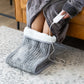 Foot warmer plush with caster wheels and side handle rail