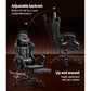 Grey leather office chair with armrests and tapered chair legs