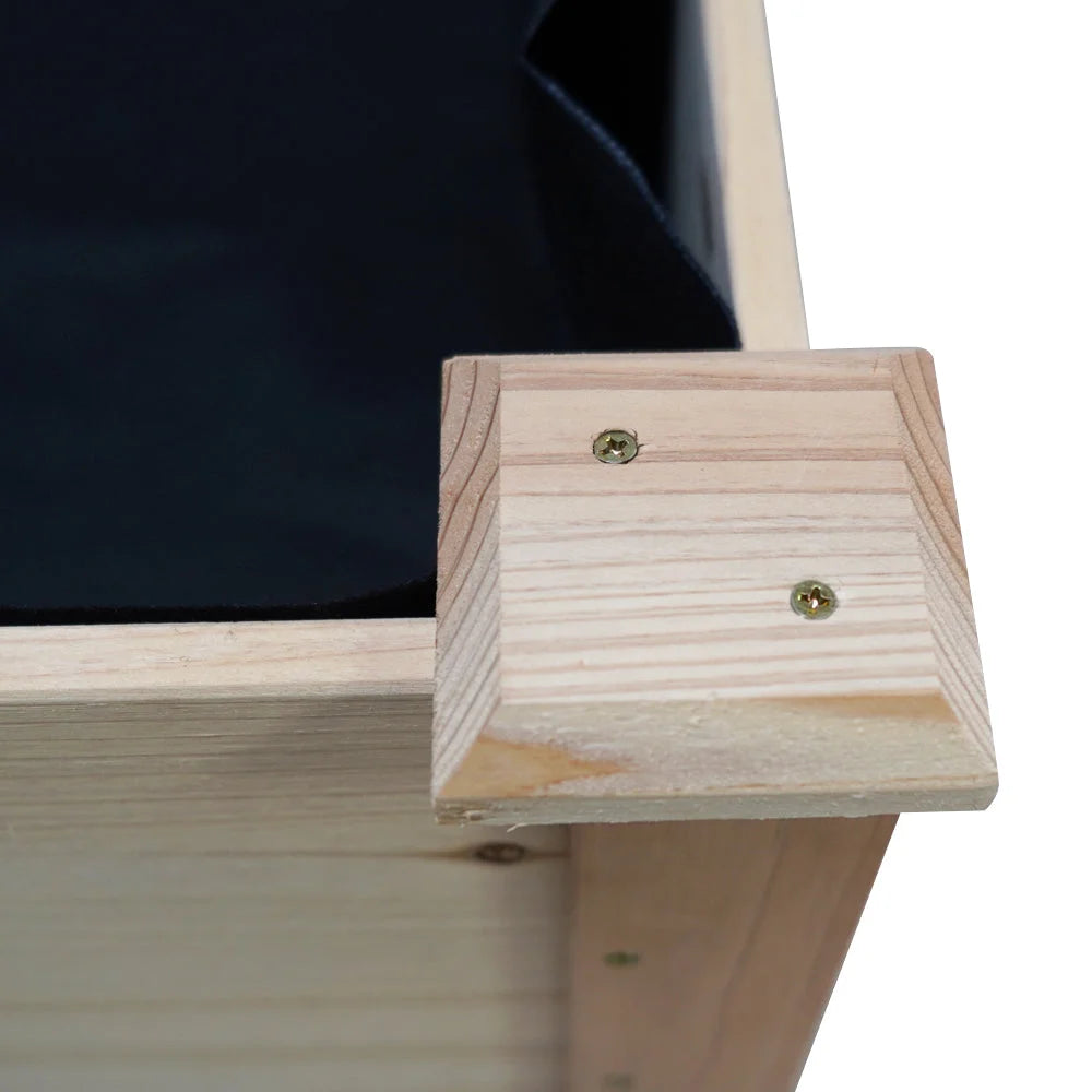 Wooden raised garden bed with metal planter walls and raised profile