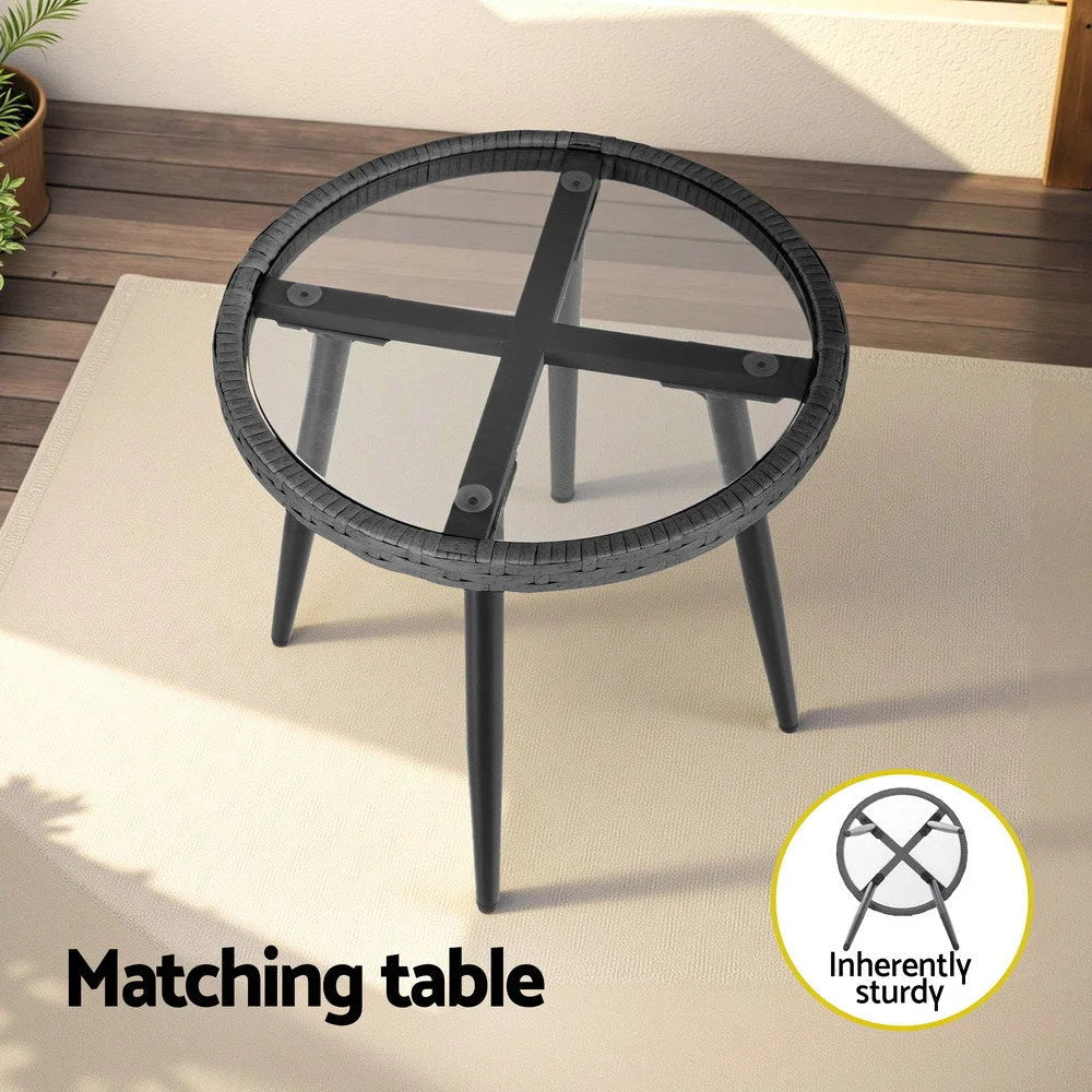 Grey outdoor lounge set with seat cushions and low coffee table