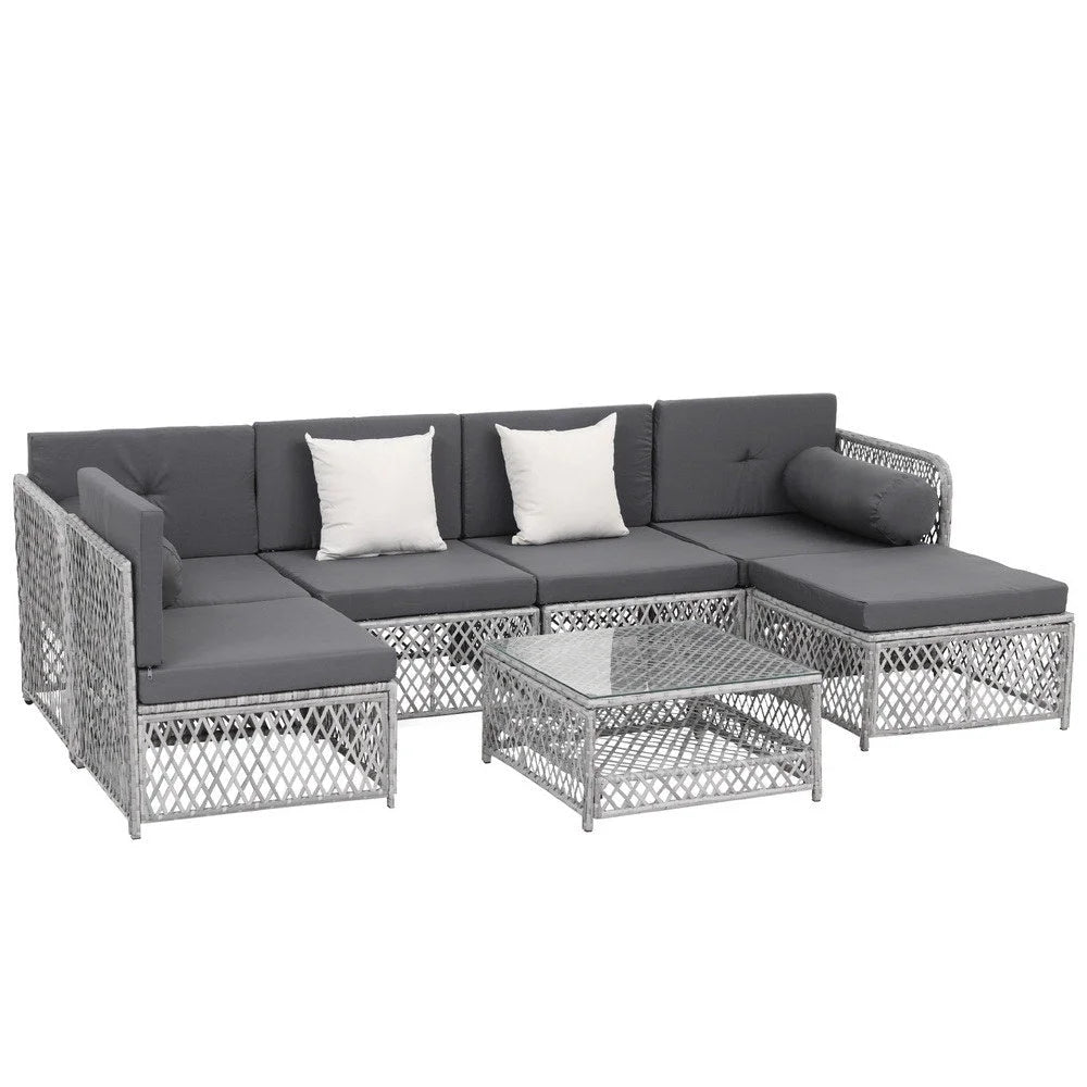 Seater outdoor sofa with seat cushions and low coffee table