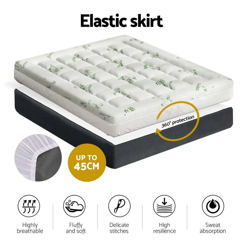 Mattress topper with front fabric panel and stitched edging