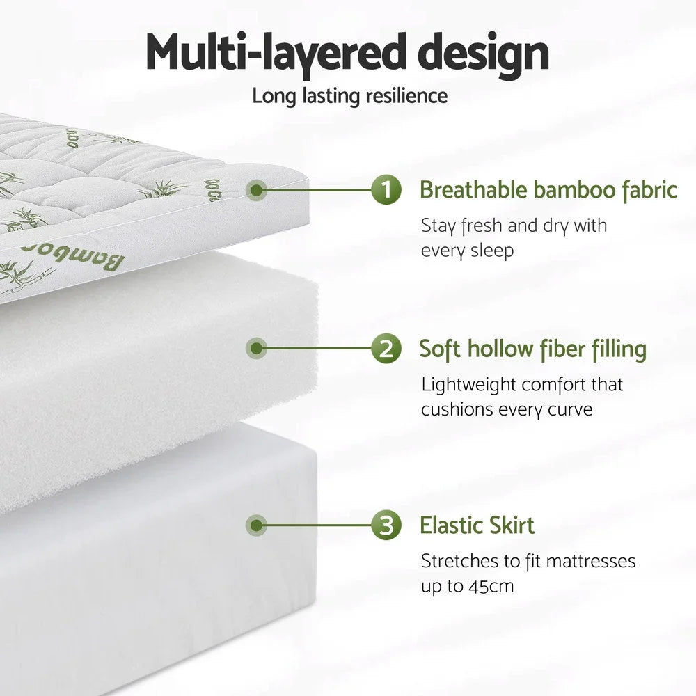 Mattress topper with foam layer and stitched cover