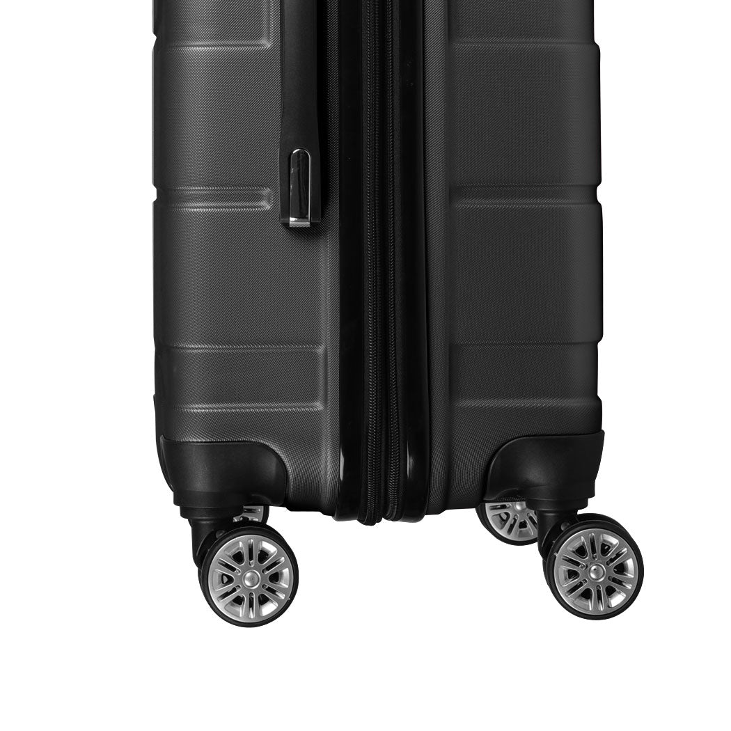 Side view of the black Slimbridge suitcase and spinner wheels