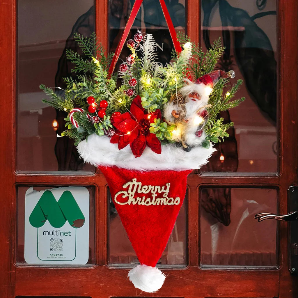 Illuminated Santa Hat Door Hanger with Holiday Greenery &
