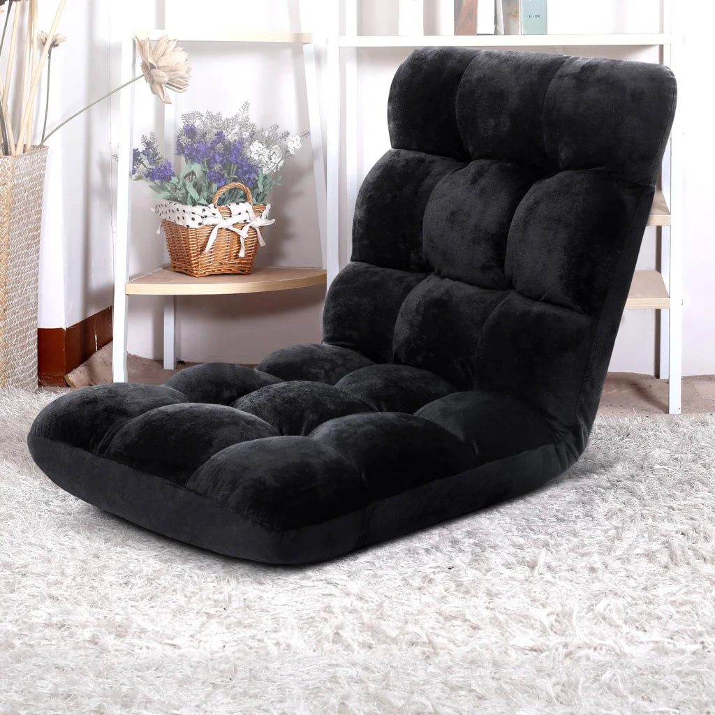Black floor lounge sofa with velvet floor cushions and low lounge back