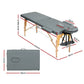 Massage Table 56CM Portable 2-Fold Wooden Beauty Bed - Grey shown with visible product details