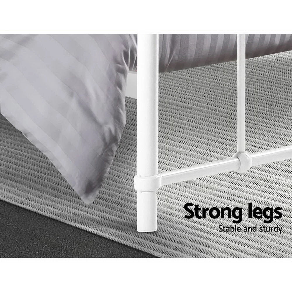 White metal mattress with layered cushioning and fabric casing